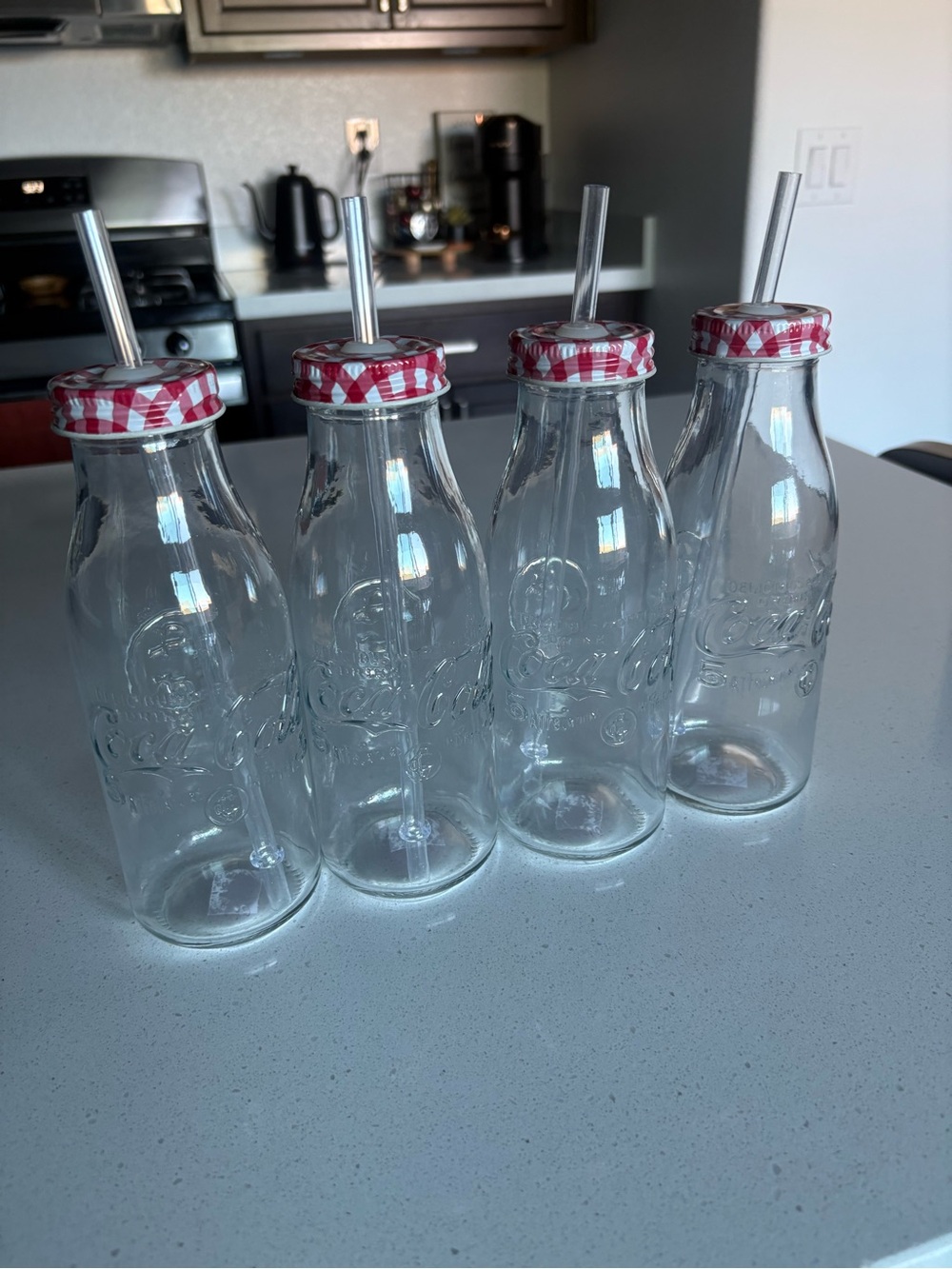 Coca Cola Clear Glass Milk Bottles with Red Gingham Lids and Plastic Straws